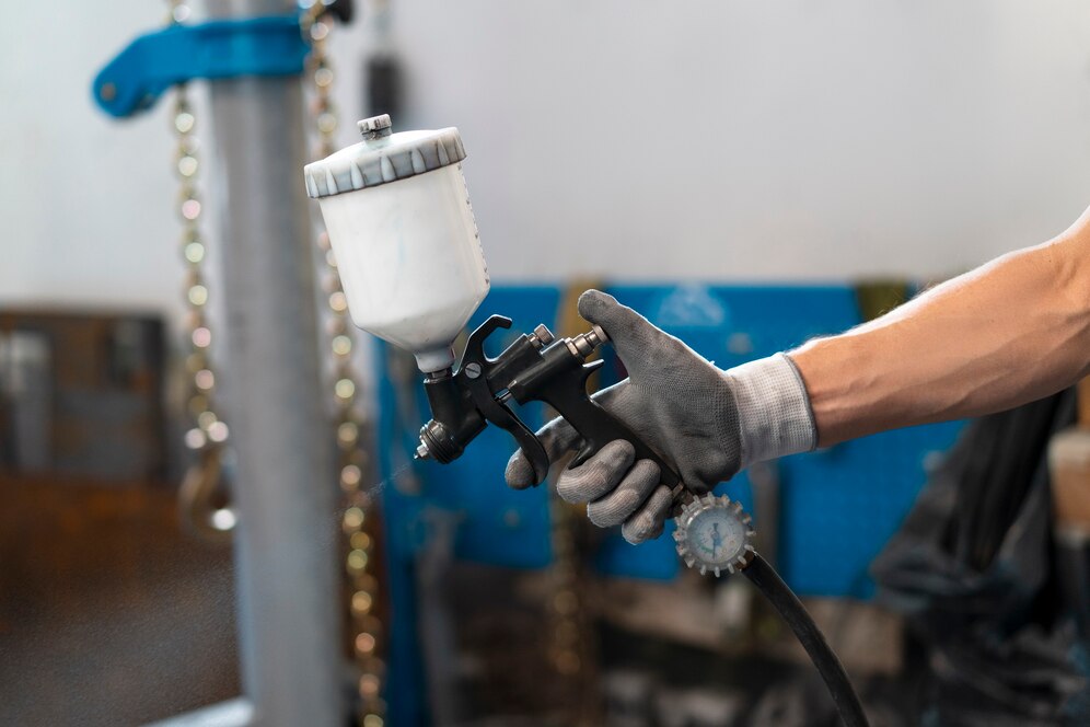male-painter-overalls-doing-his-work-car-shop-23-2149750001.jpg